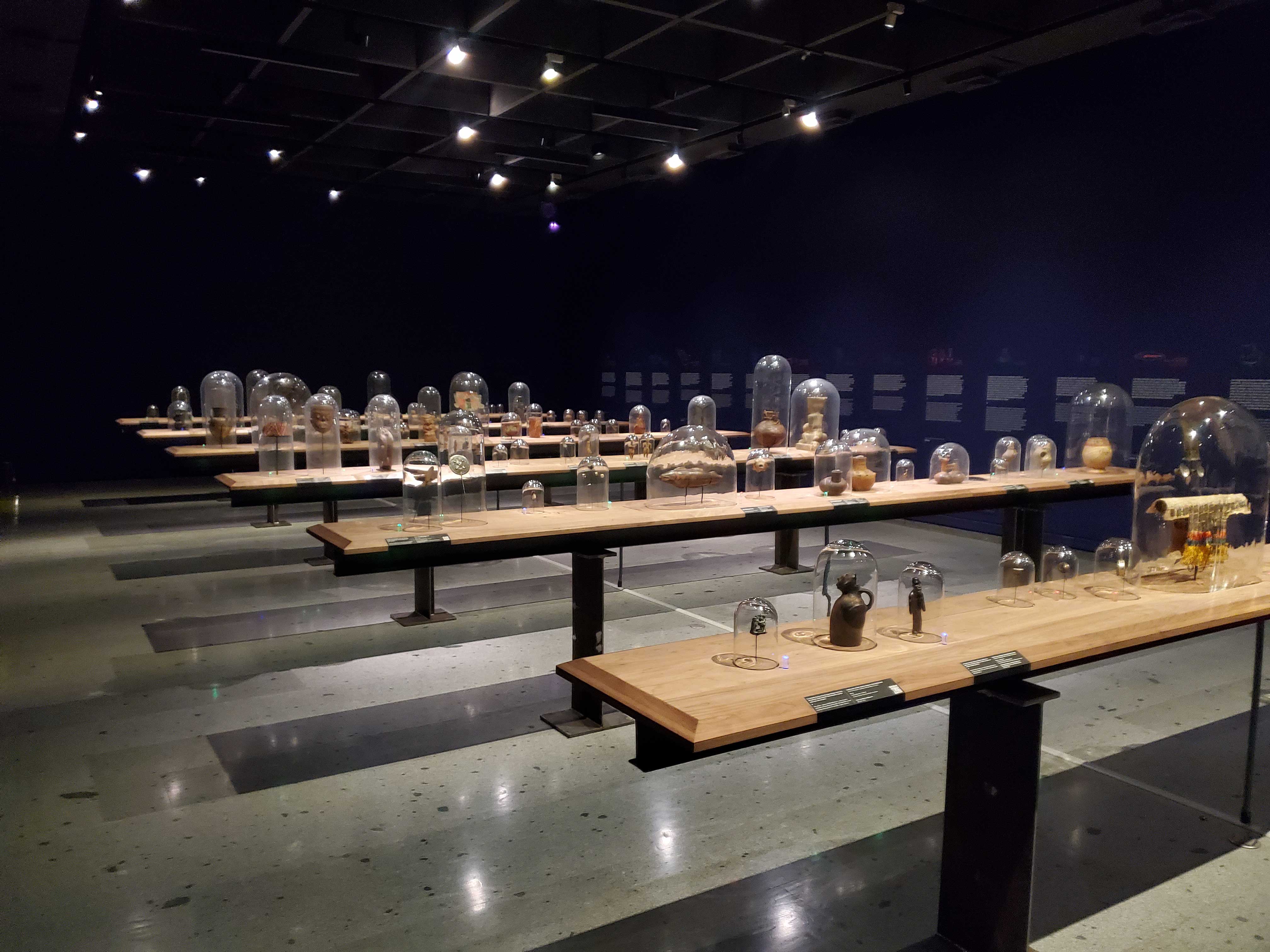 Artifacts under bell jars and the Pre Columbian Art Museum in Santiago Chile