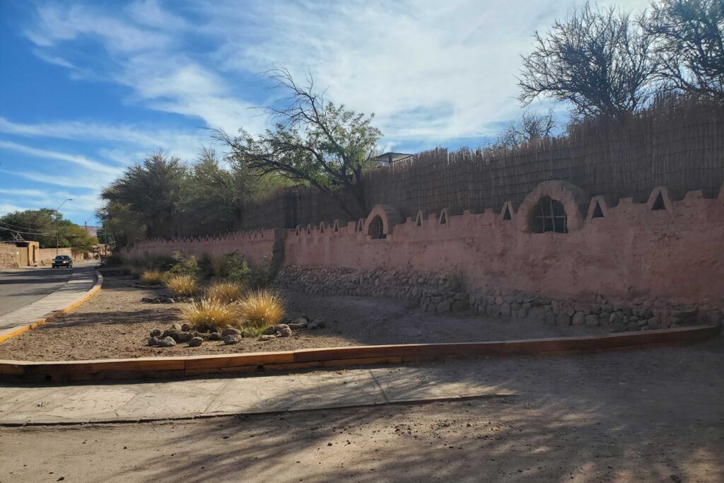 Decorative adobe wall along the pedestrian walkway into San Pedro downtown