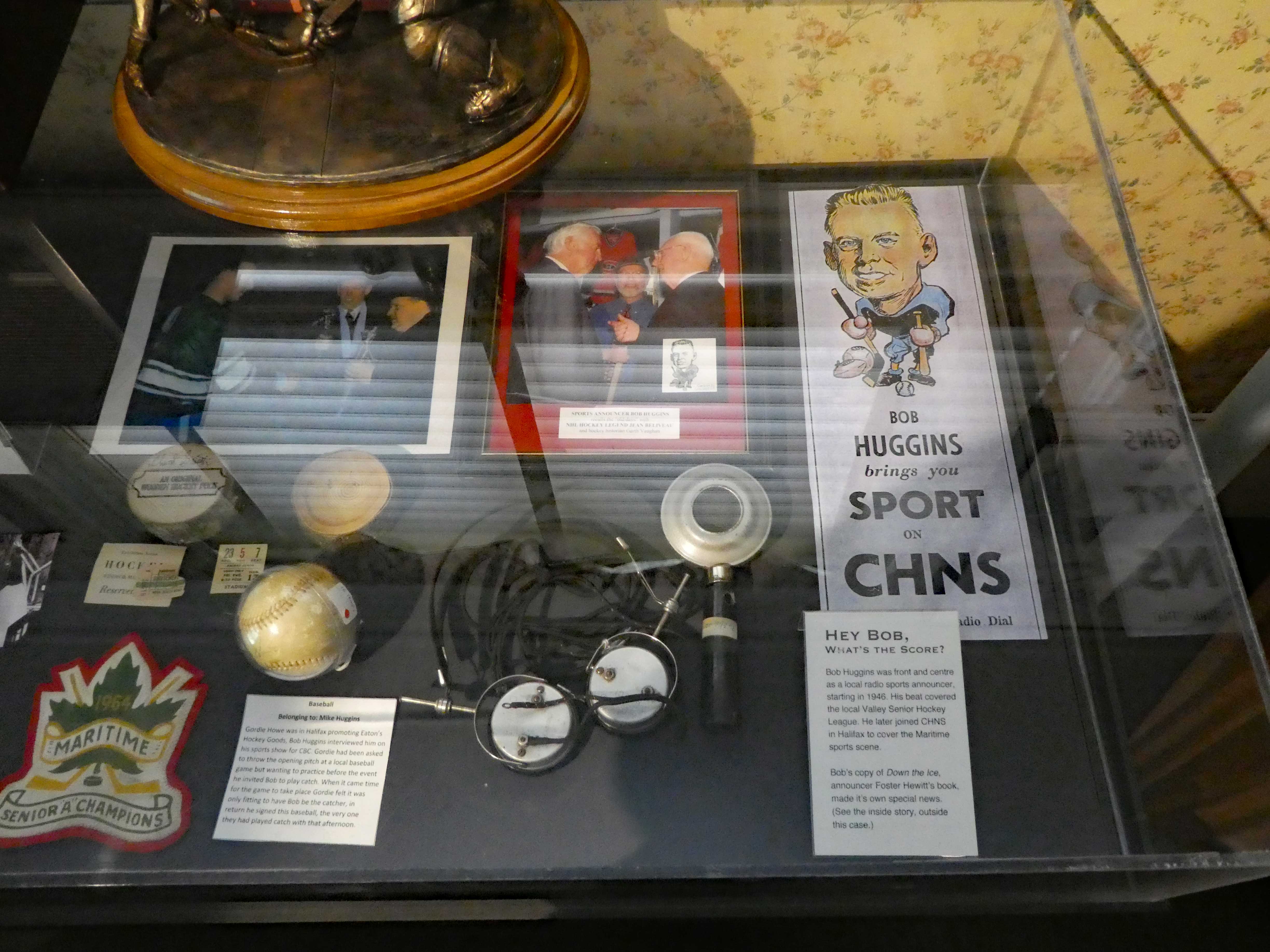 Display case with original wooden hockey pucks