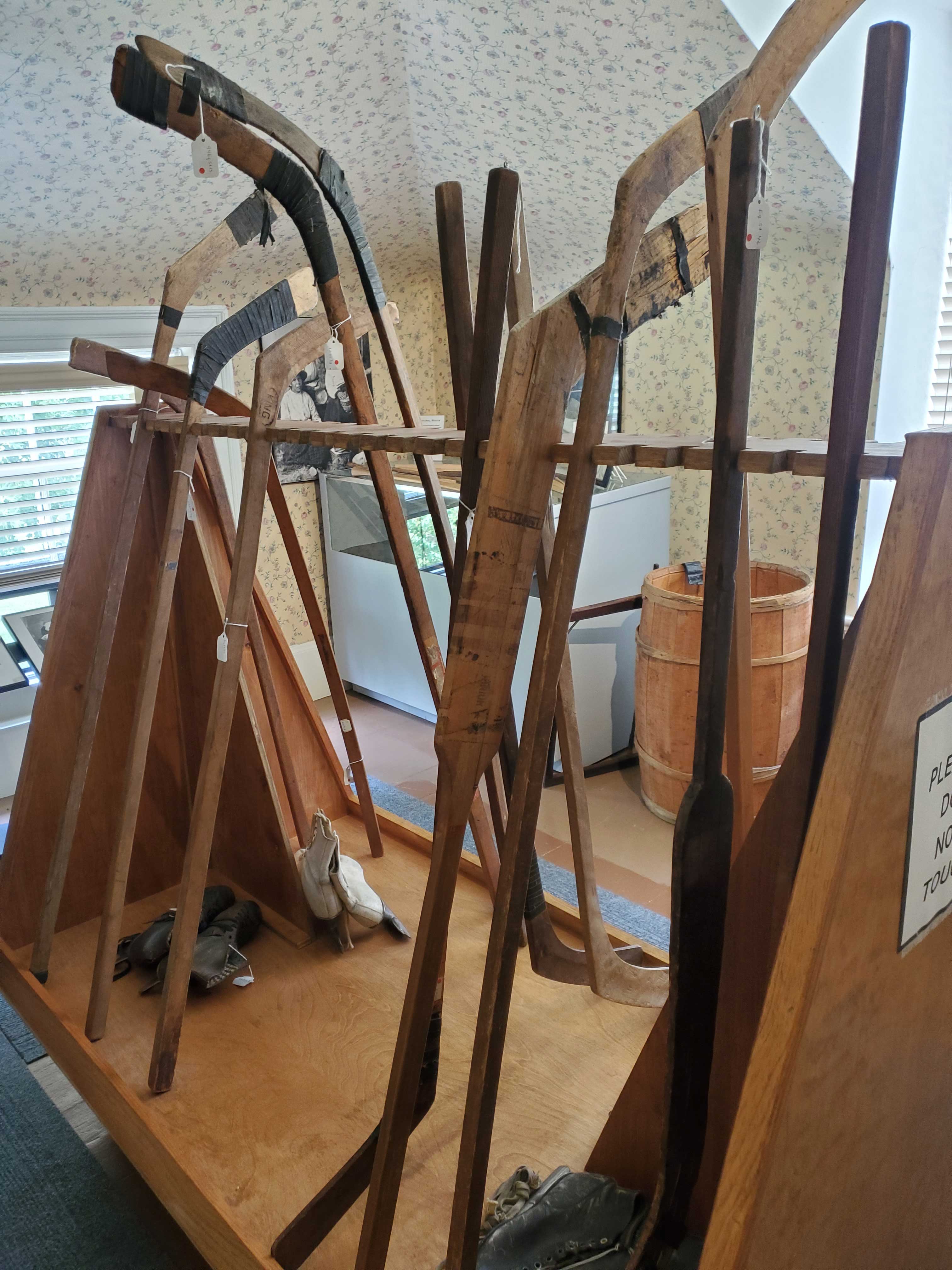 Original wooden hockey sticks carved from the curved roots of trees