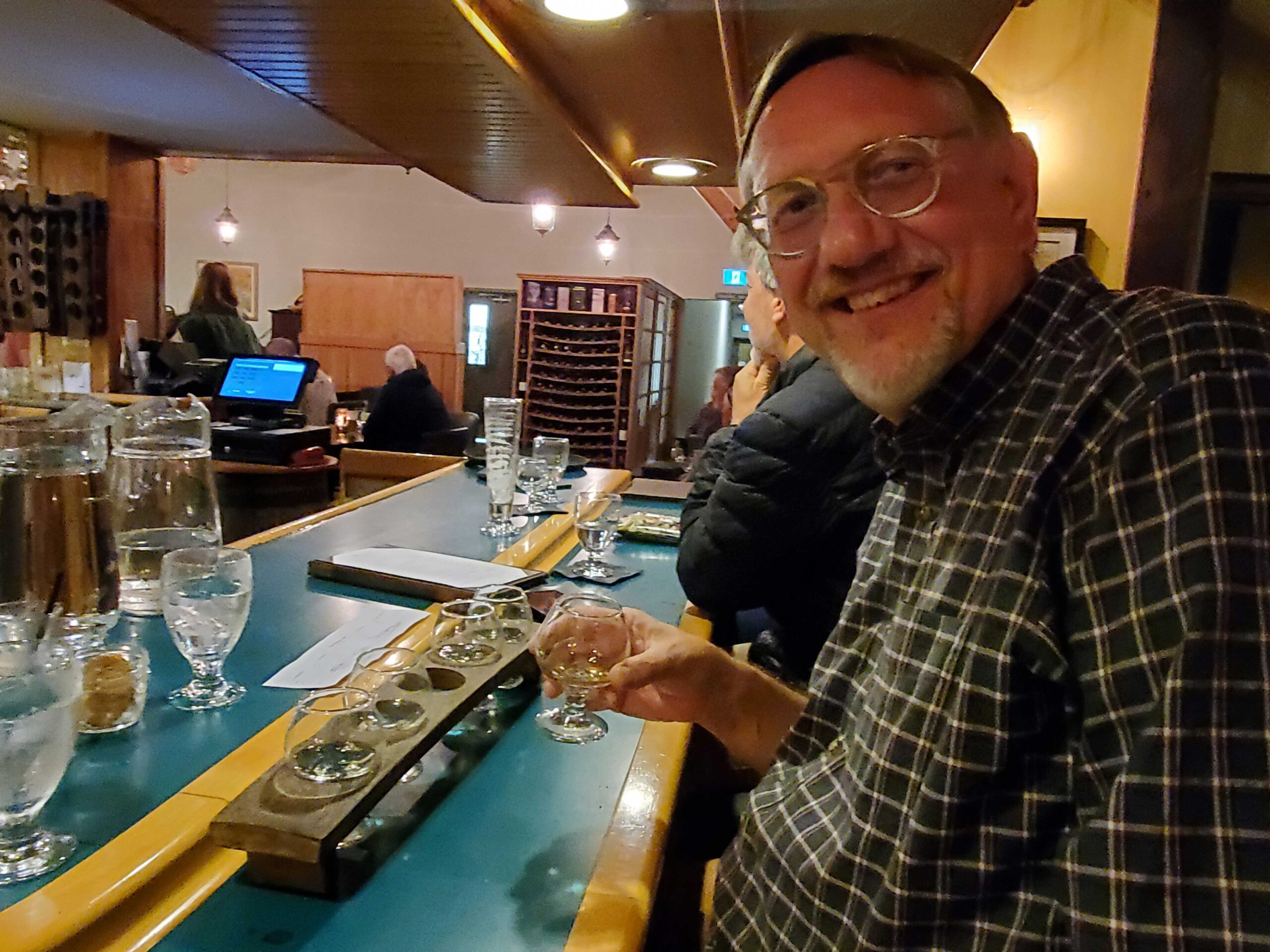 Jake enjoying tasters of single malt whiskey at the Glennora Distillery in Cape Breton Island, Nova Scotia