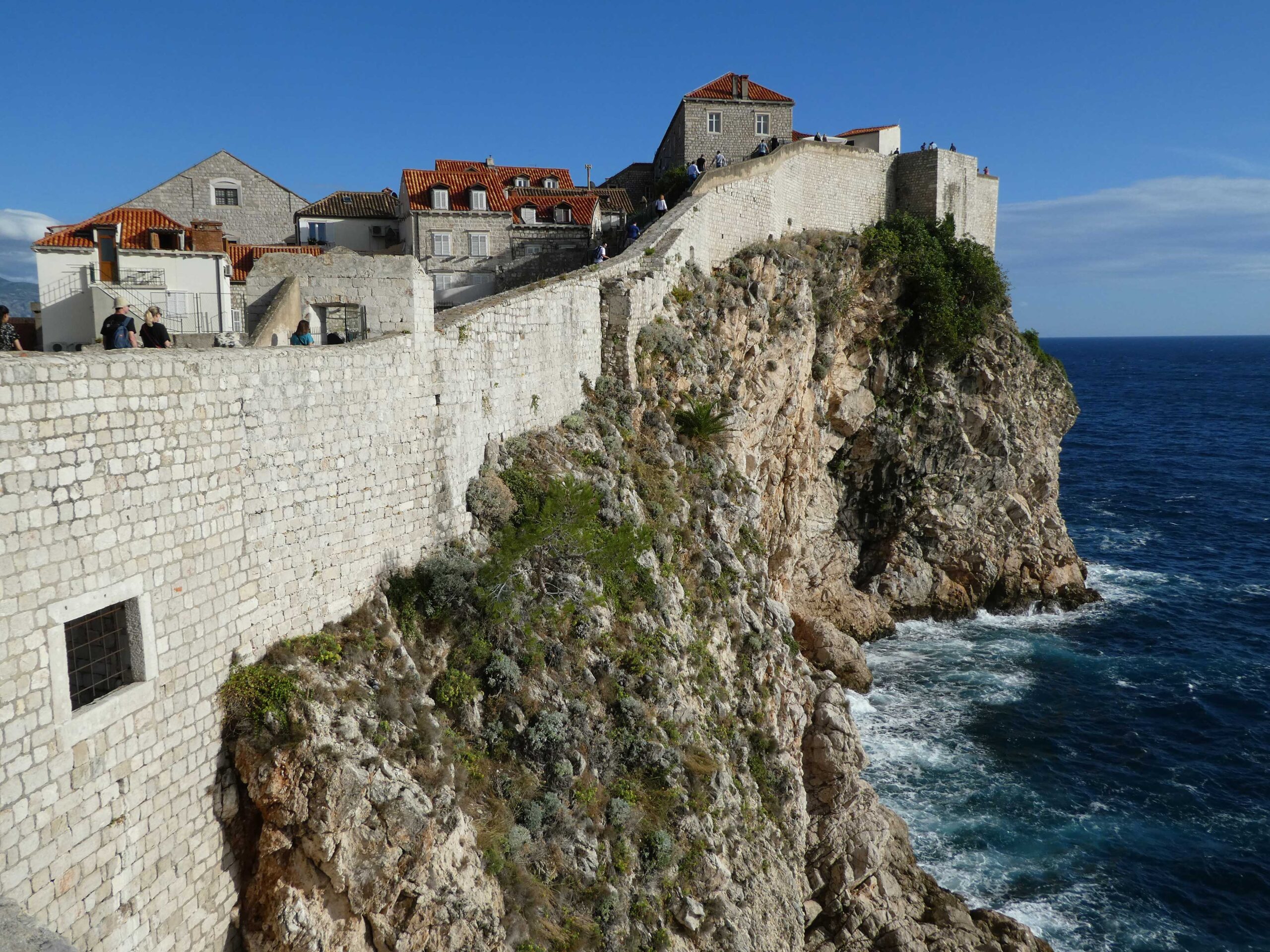 Fortress walls of Dubrovnik climbing up the sea cliffs