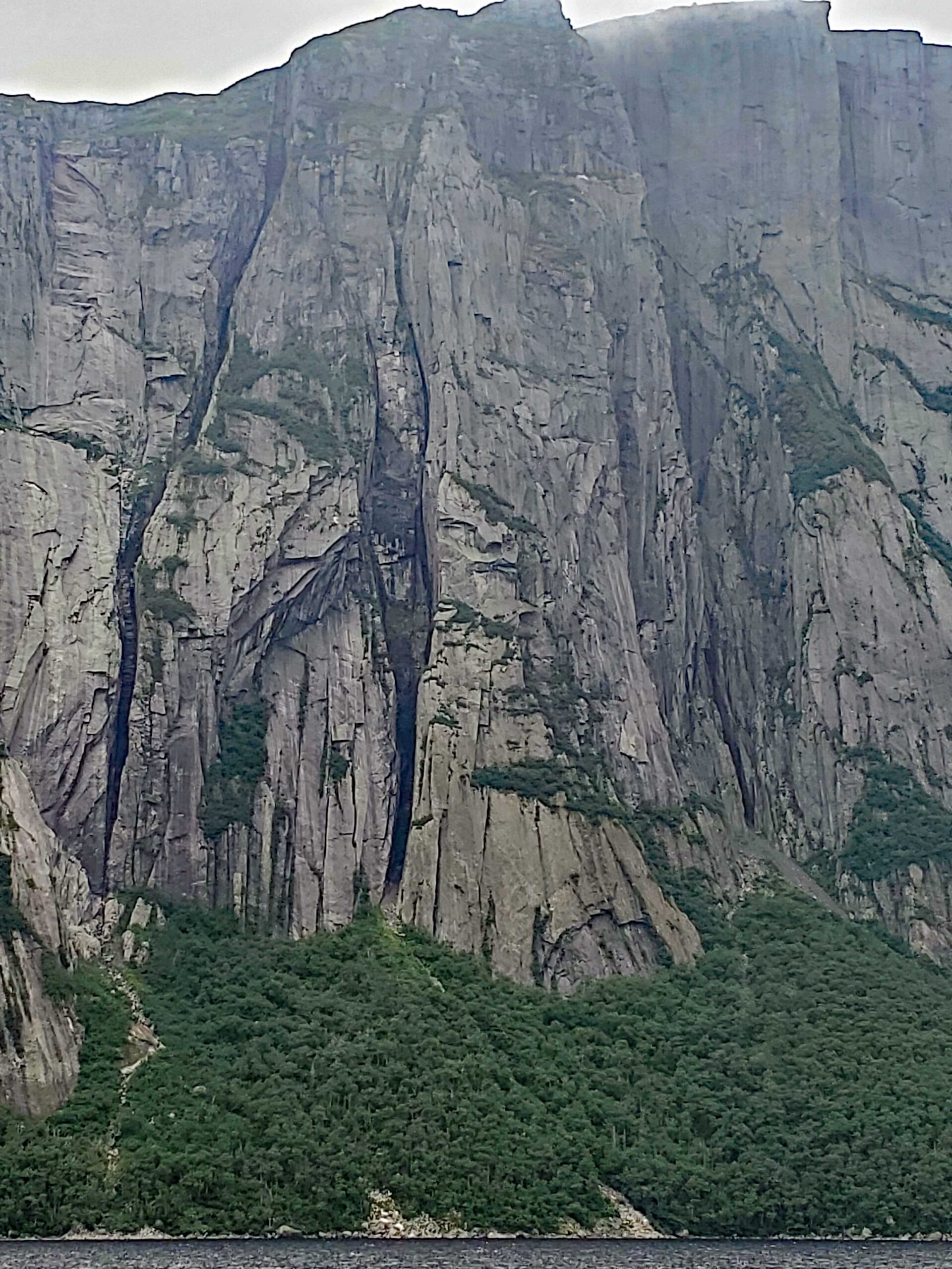 Tinman feature on the cliff face of the fjords at Western Brook Pond, Newfoundland