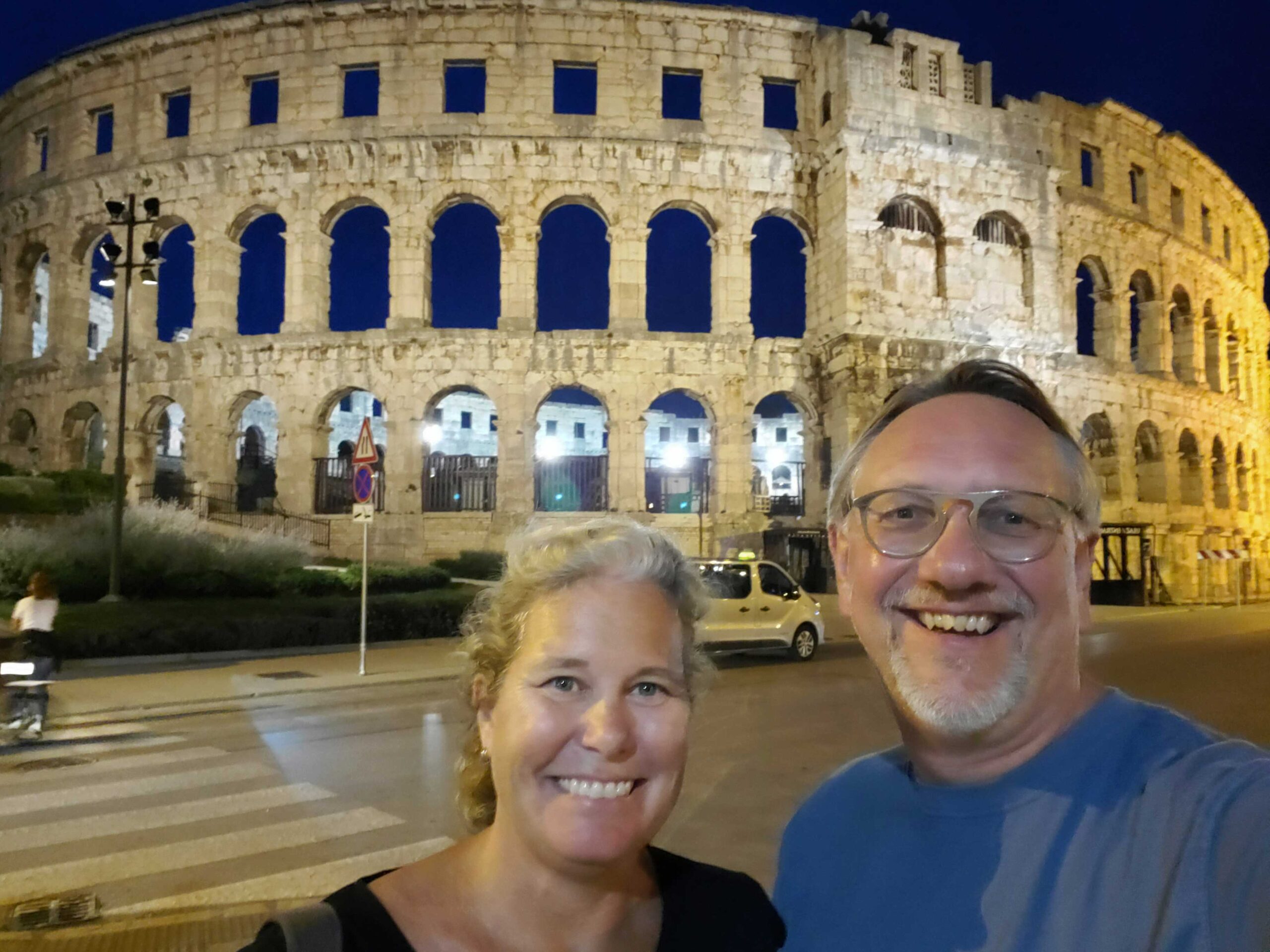 Ande and Jake outside the amphitheater in Pula, Croatia in the evening