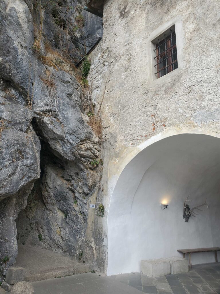 Walls join with the cliff face inside Predjama castle