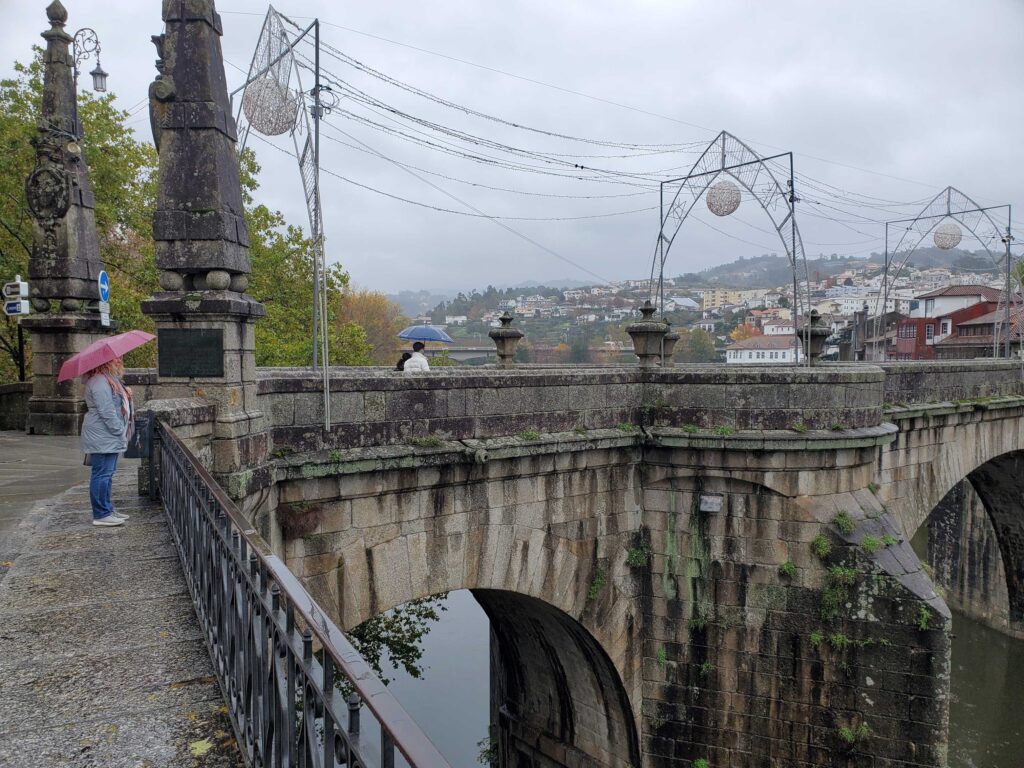 Andrea near the stone bridge in Amarante, Portugal
