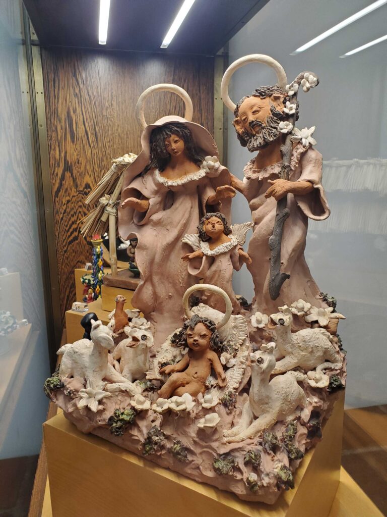A stylized clay nativity scene in the collection displayed at the Church of San Francisco in Évora, Portugal