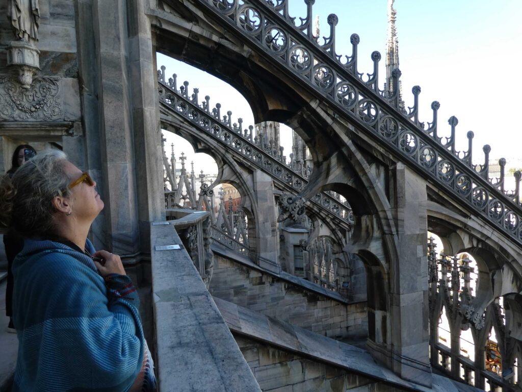 Ande on the roof of the Duomo in Milan, Italy near the roof buttresses